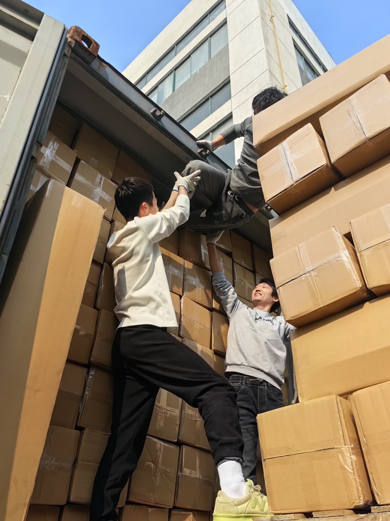 Cartons being loaded for a mattress export shipment